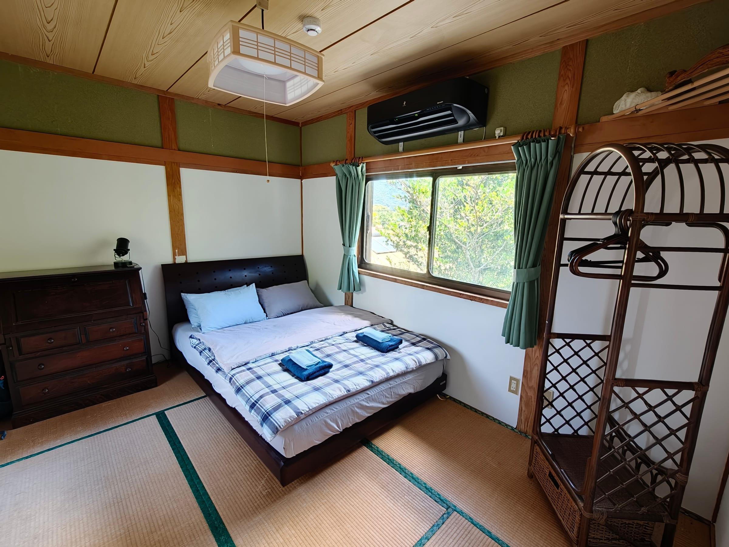 Queen bedroom with a mountain view