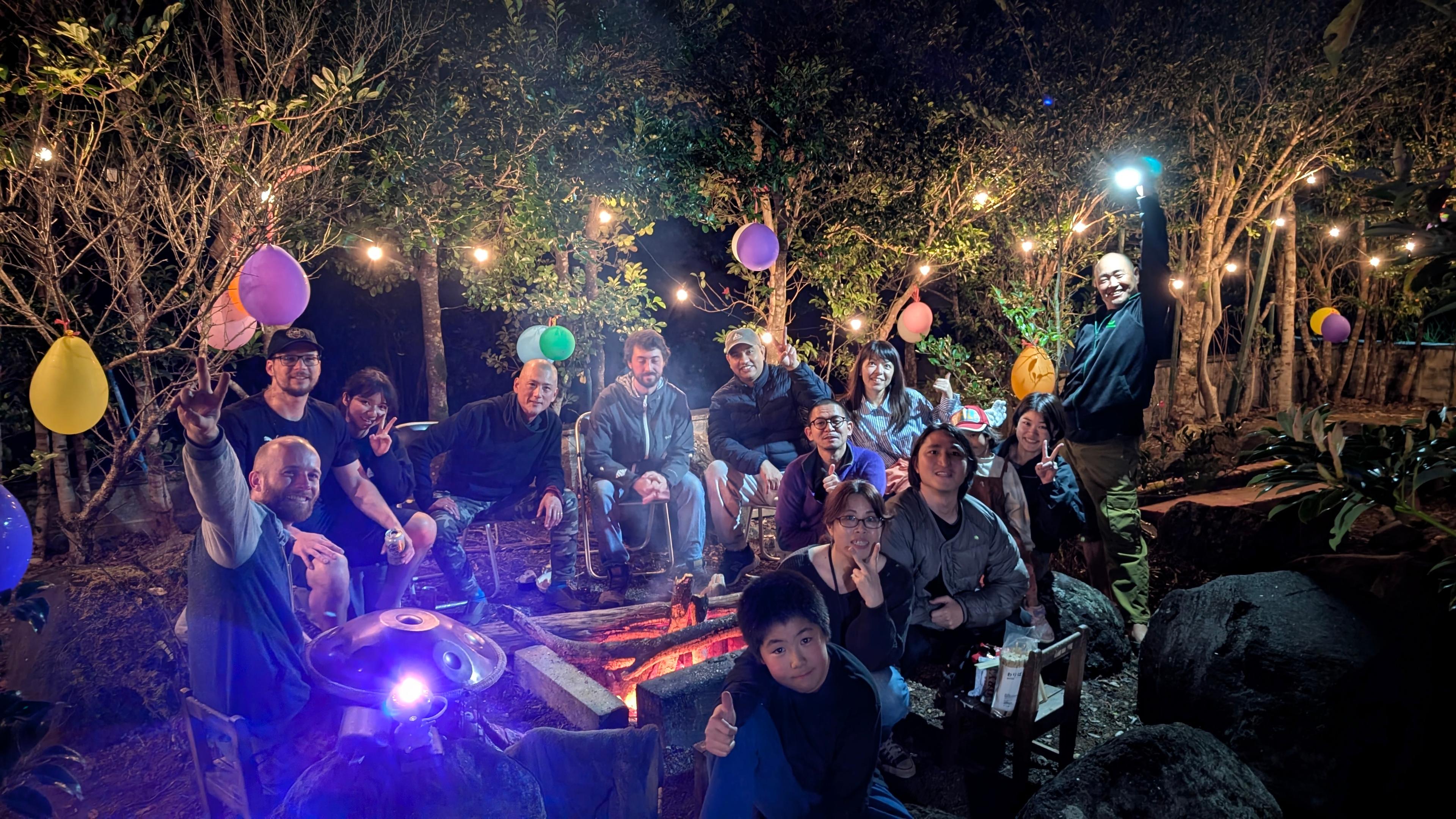Evening campfire and BBQ gathering in the garden